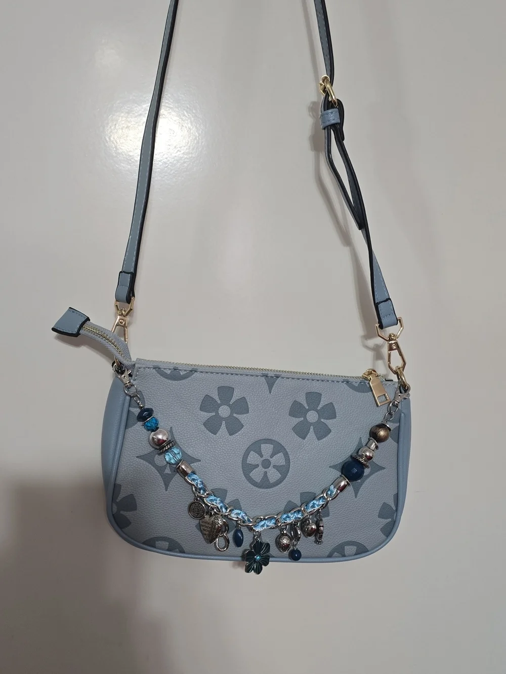 Light Blue Floral Charm Crossbody Bag .